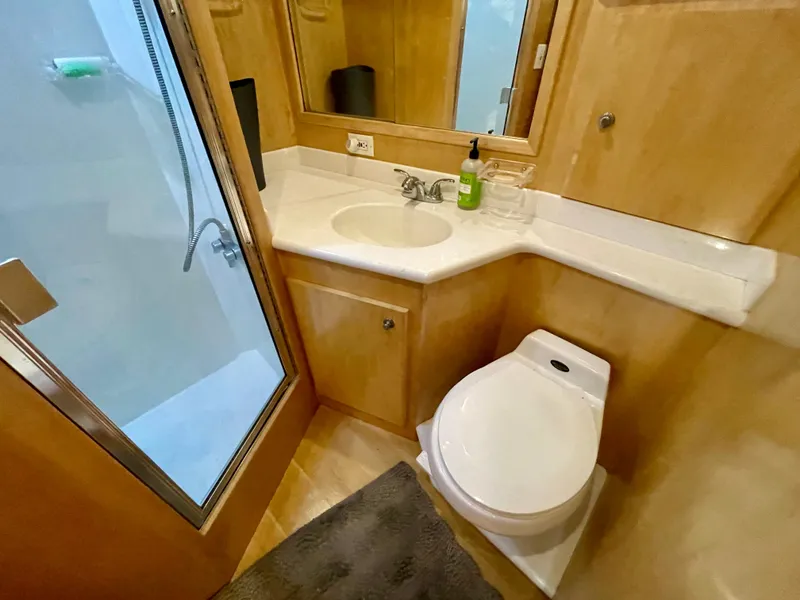 Slide: The Image of Compact bathroom in a 1999 Californian 39 yacht with shower, sink, and toilet. - 29