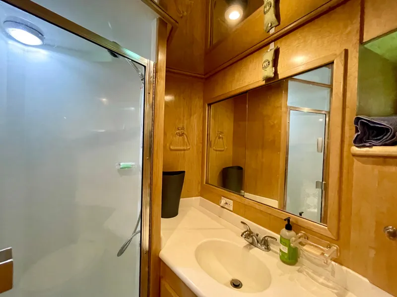 Slide: The Image of 1999 Californian 39 bathroom with shower, sink, and wooden cabinetry. - 30