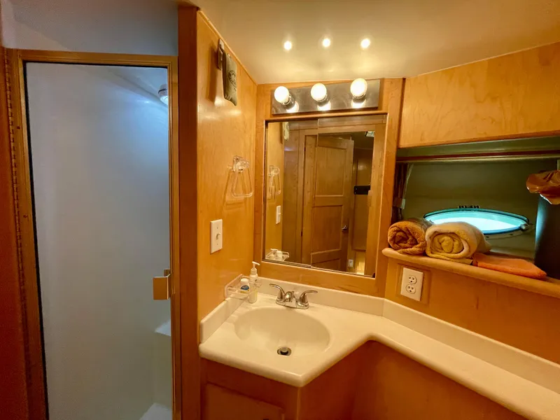 Slide: The Image of 1999 Californian 39 bathroom with sink, mirror, and shower. - 35