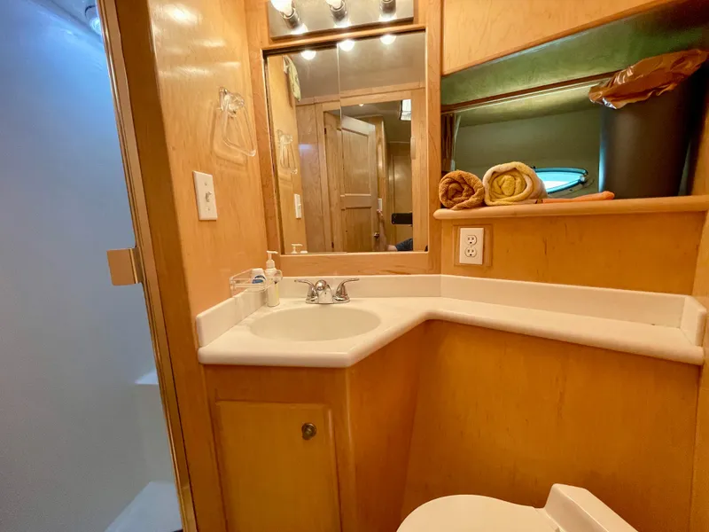 Slide: The Image of 1999 Californian 39 yacht bathroom with sink, mirror, and shower. - 36