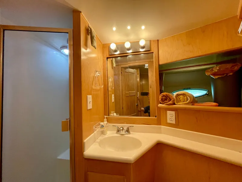 Slide: The Image of 1999 Californian 39 yacht bathroom with sink, mirror, and shower. - 37