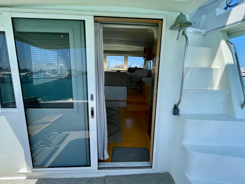 Slide: The Image of 1999 Californian 39 yacht interior view through sliding glass door. - 39