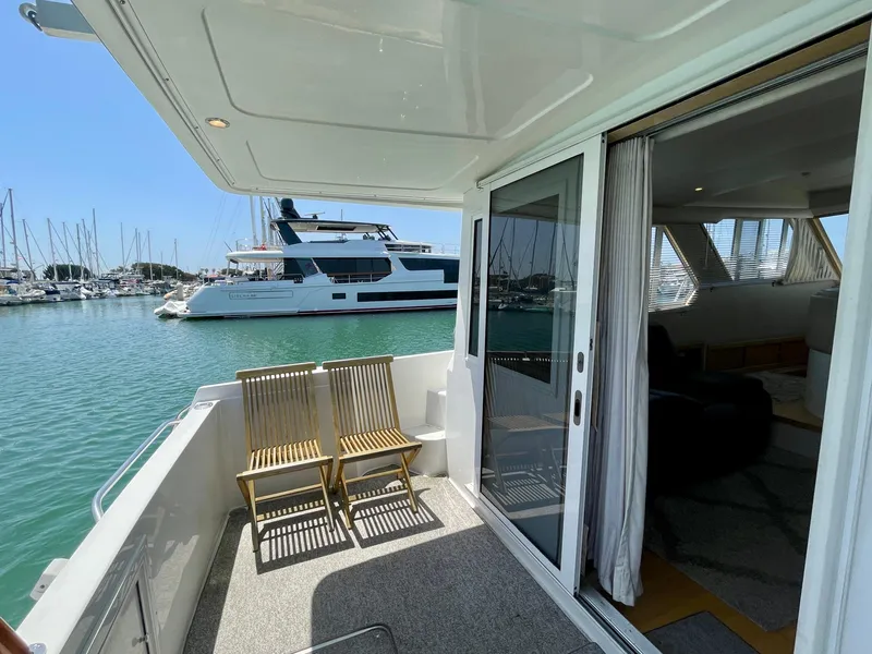 Slide: The Image of 1999 Californian 39 yacht with open deck and marina view. - 40