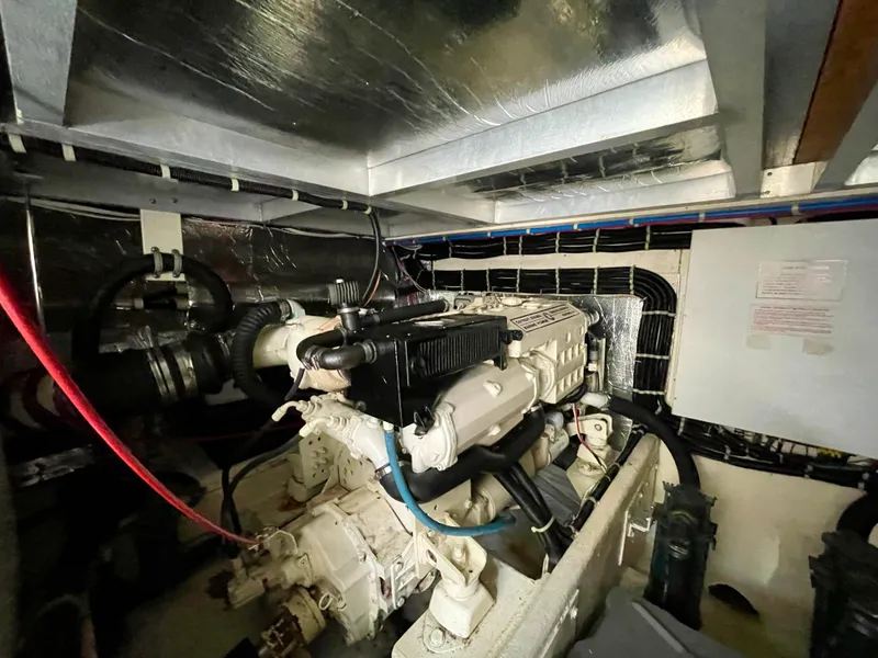Slide: The Image of Engine room of a 1999 Californian 39 yacht with visible engine components. - 8