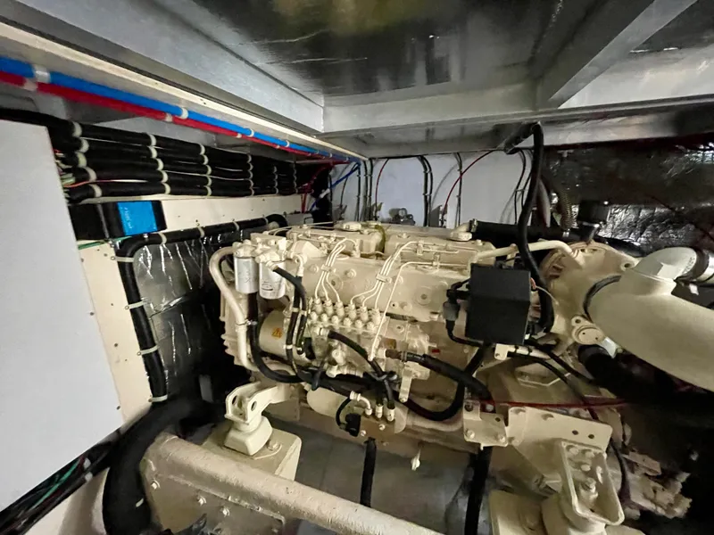 Slide: The Image of Engine room of a 1999 Californian 39 yacht with detailed wiring and components. - 9