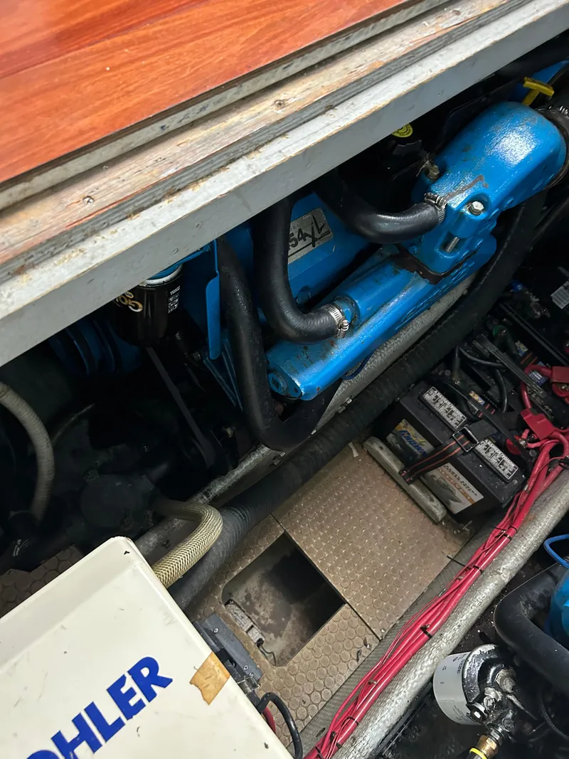 Slide: The Image of Engine compartment of a 1995 Silverton AFT CABIN boat with visible components and wiring. - 22