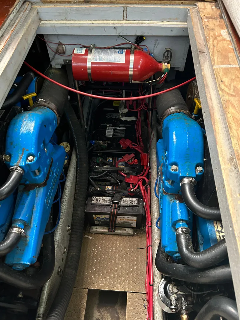 Slide: The Image of Engine compartment of a 1995 Silverton AFT CABIN boat with visible fire extinguisher. - 23