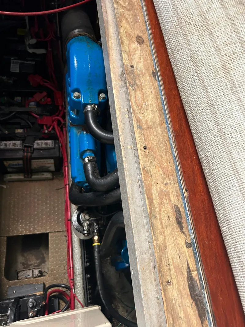 Slide: The Image of Engine compartment of a 1995 Silverton AFT CABIN boat, featuring blue engine components. - 24