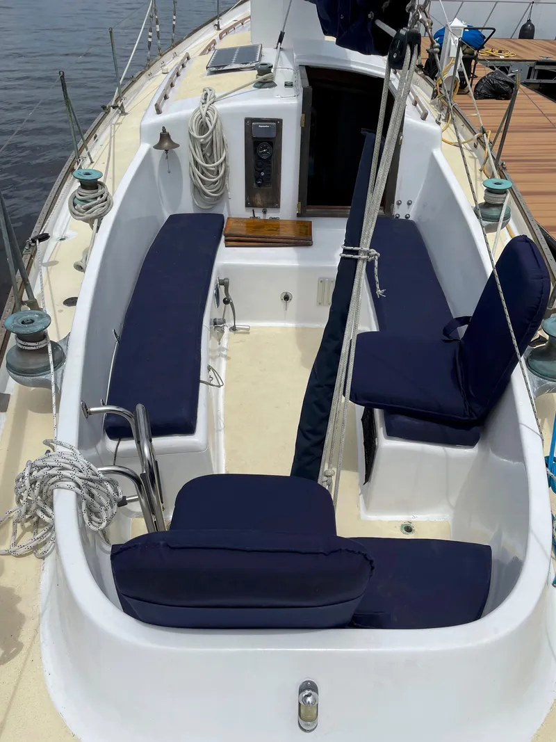 Slide: The Image of 1960 Rhodes Bounty II sailboat cockpit with navy cushions and nautical equipment. - 20