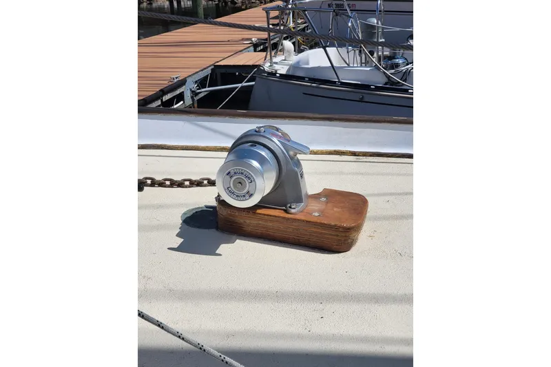 Slide: The Image of Vintage 1960 Rhodes Bounty II sailboat deck with anchor windlass. - 24