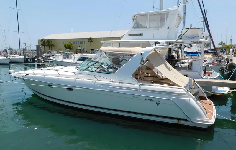 The Image of 1999 Formula 41 Performance Cruiser docked at a marina. - 0