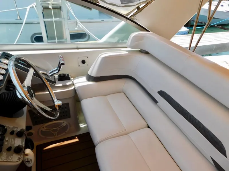 Slide: The Image of 1999 Formula 41 Performance Cruiser cockpit with white leather seating and steering wheel. - 11