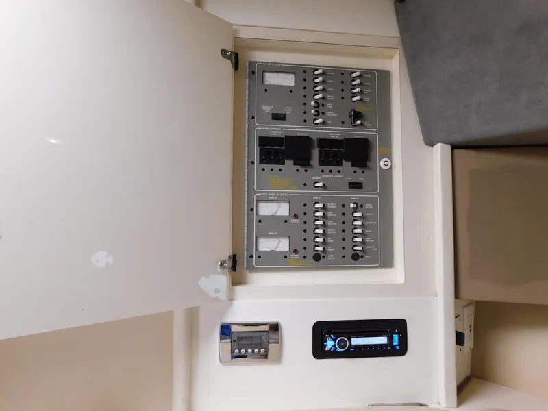 Slide: The Image of Electrical control panel inside a 1999 Formula 41 Performance Cruiser boat. - 26