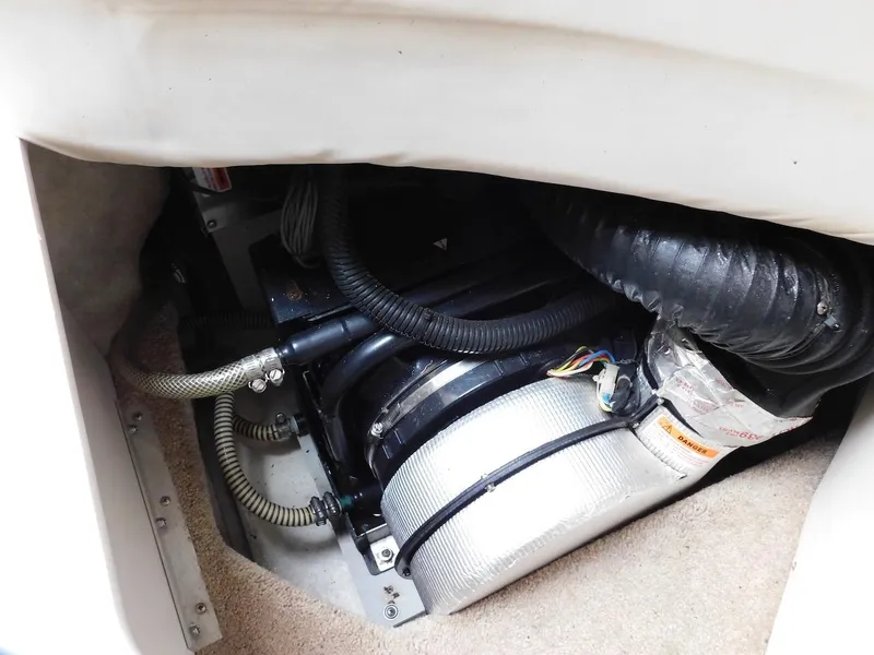 Slide: The Image of 1999 Formula 41 Performance Cruiser engine compartment with hoses and components. - 29