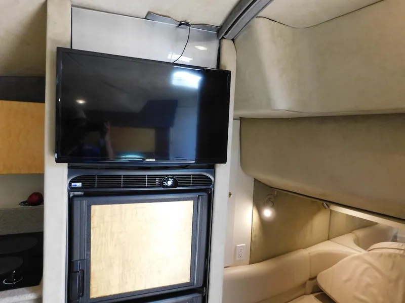 Slide: The Image of Interior of a 1999 Formula 41 Performance Cruiser with TV and seating area. - 30