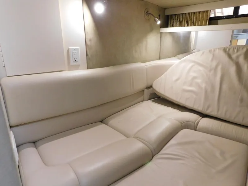Slide: The Image of Interior seating area of a 1999 Formula 41 Performance Cruiser with beige leather upholstery. - 33
