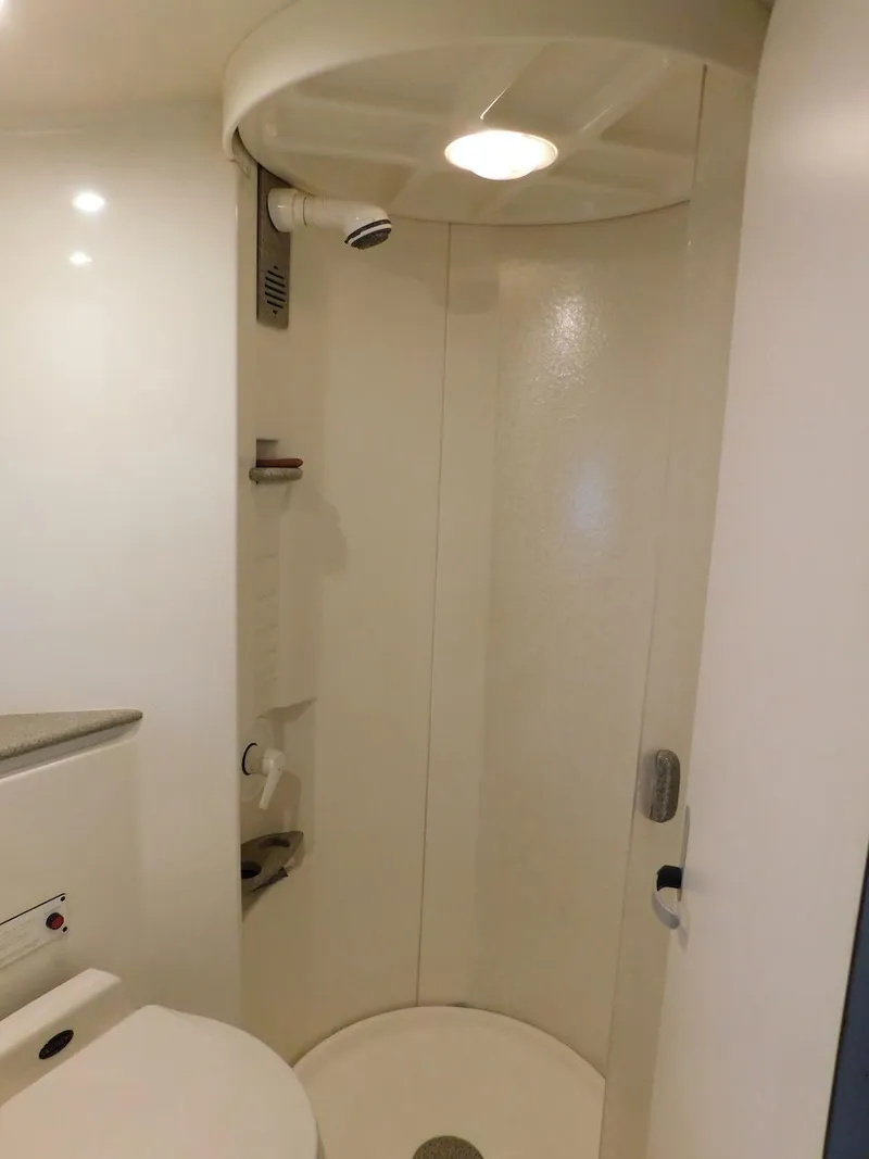 Slide: The Image of 1999 Formula 41 Performance Cruiser bathroom with a compact shower. - 41
