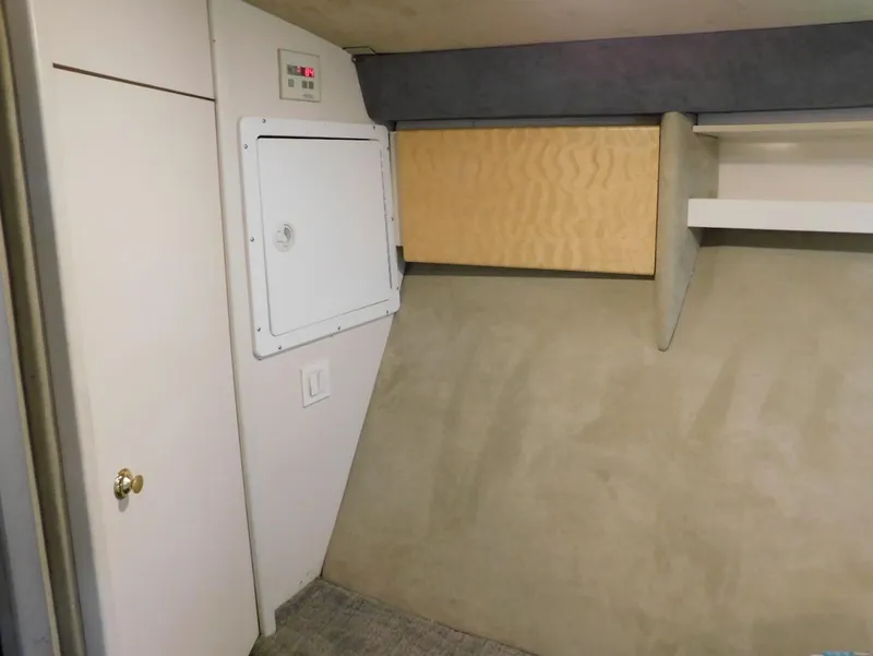 Slide: The Image of Interior of 1999 Formula 41 Performance Cruiser, featuring storage compartments and control panel. - 46