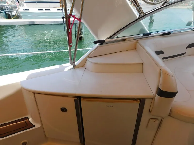 Slide: The Image of 1999 Formula 41 Performance Cruiser interior with seating and mini fridge. - 49