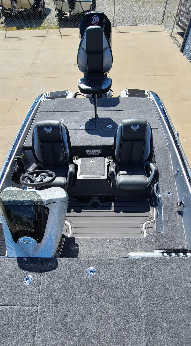 Slide: The Image of 2025 Phoenix 920 Elite 1 boat interior with dual seats and steering console. - 5
