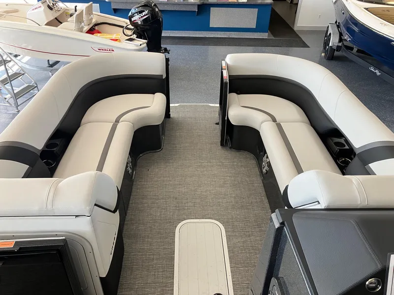 Slide: The Image of 2024 Crest Caribbean 230 SLS RS boat interior with gray and black seating. - 12