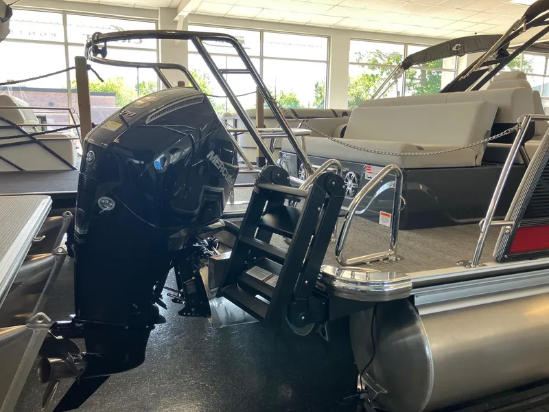 Slide: The Image of 2024 Crest Caribbean 230 SLS RS pontoon boat with Mercury outboard motor. - 4