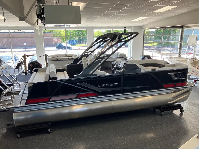 Slide: The Image of 2024 Crest Caribbean 230 SLS RS pontoon boat in showroom. - 5