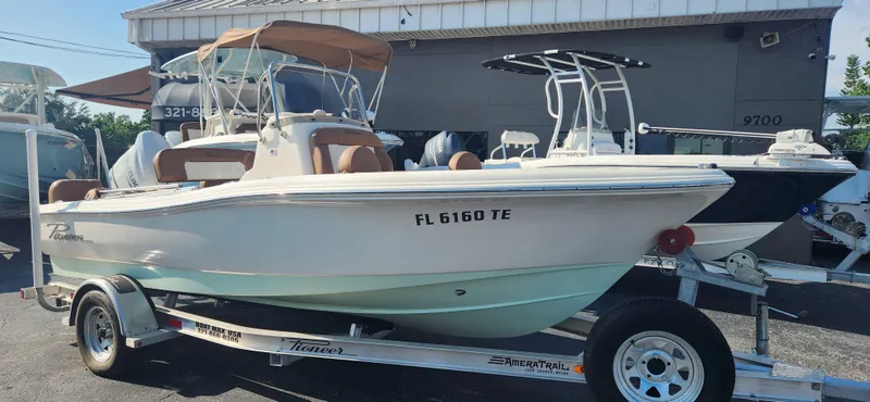 Slide: The Image of 2022 Pioneer 180 Islander boat on trailer in a marina. - 10