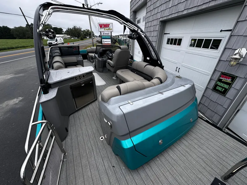 Slide: The Image of 2021 Avalon Excalibur 2585 Windshield Elite boat, tri-toon design, luxurious seating, high-performance features. - 11