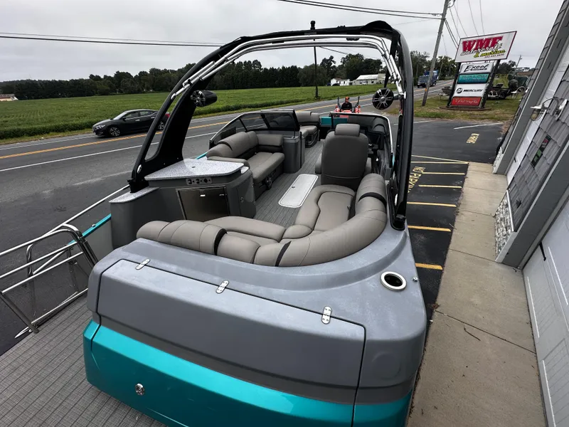 Slide: The Image of 2021 Avalon Excalibur 2585 Windshield Elite Tri Toon boat with luxurious seating and high-performance design. - 12