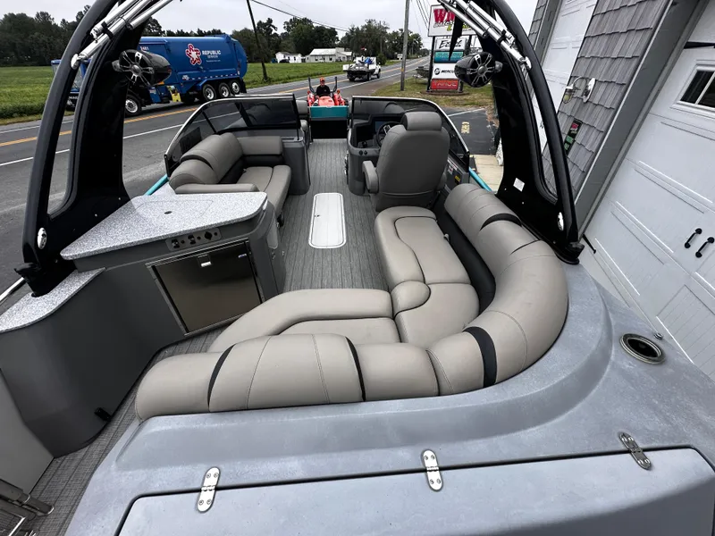 Slide: The Image of 2021 Avalon Excalibur 2585 Windshield Elite boat interior with luxurious seating and modern design. - 13