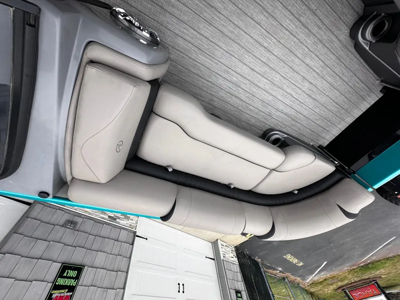 Slide: The Image of 2021 Avalon Excalibur 2585 boat interior with beige seating and gray flooring. - 14