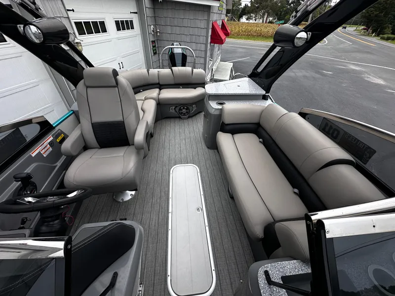 Slide: The Image of 2021 Avalon Excalibur 2585 boat interior with gray seating and modern design. - 17