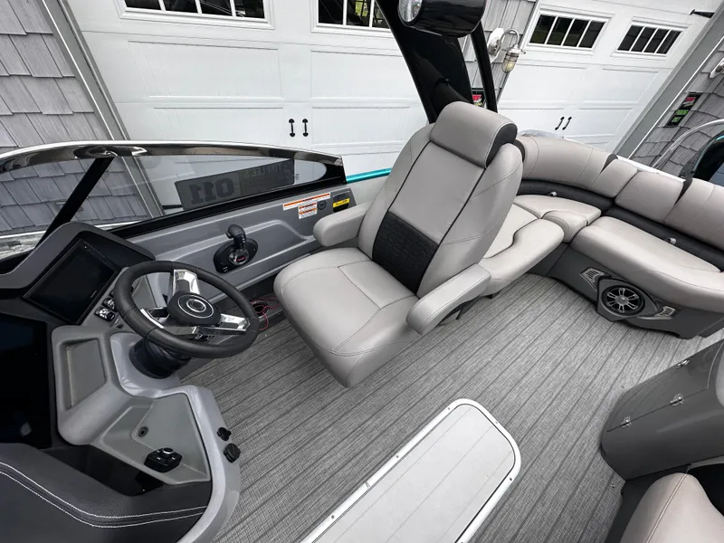 Slide: The Image of Luxurious interior of 2021 Avalon Excalibur 2585 boat with plush seating and modern dashboard. - 19