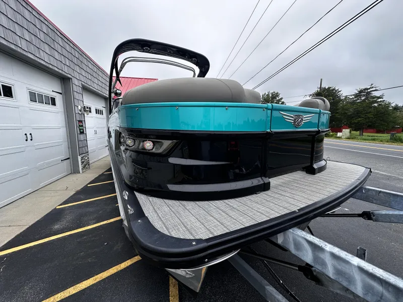 Slide: The Image of 2021 Avalon Excalibur 2585 Windshield Elite, Tri Toon, on trailer, front view. - 9