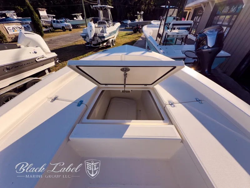 Slide: The Image of 2024 Pathfinder TRS 2200 boat with open storage compartment, displayed at Black Label Marine Group. - 10