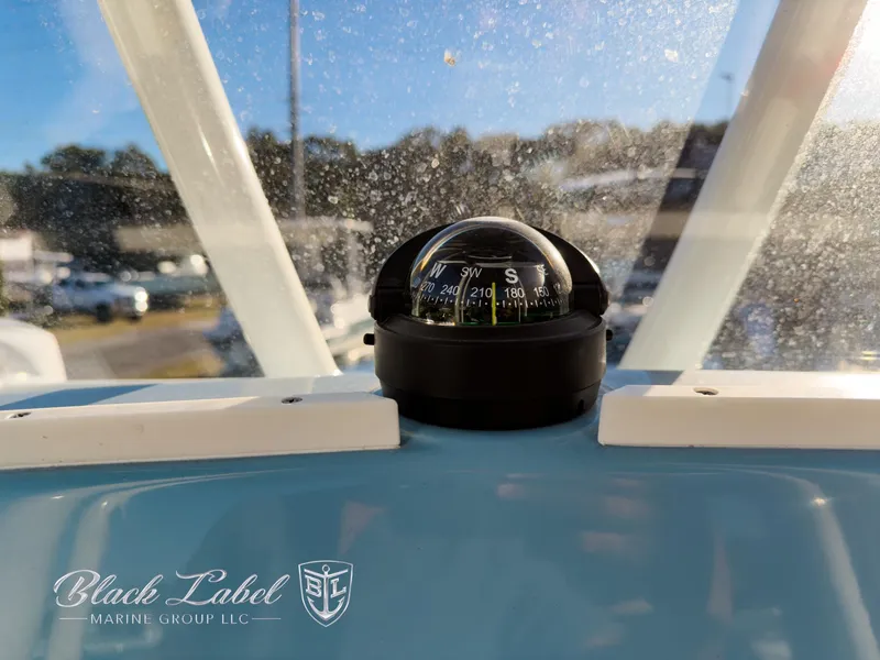 Slide: The Image of Compass on 2024 Pathfinder TRS 2200 boat dashboard, Black Label Marine Group logo visible. - 20