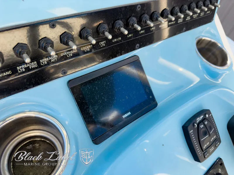 Slide: The Image of Control panel of 2024 Pathfinder TRS 2200 boat with Yamaha display and switches. - 22