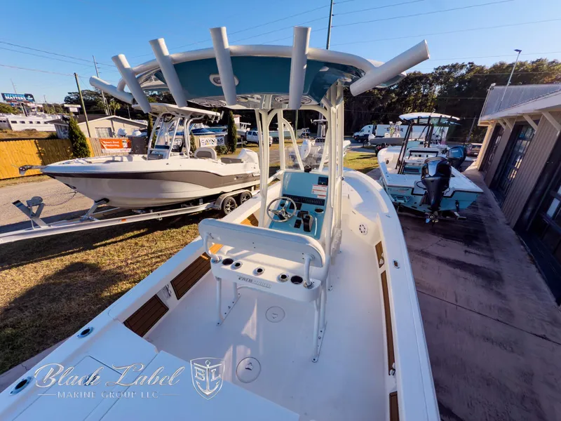 Slide: The Image of 2024 Pathfinder TRS 2200 boat displayed outdoors at a dealership. - 31