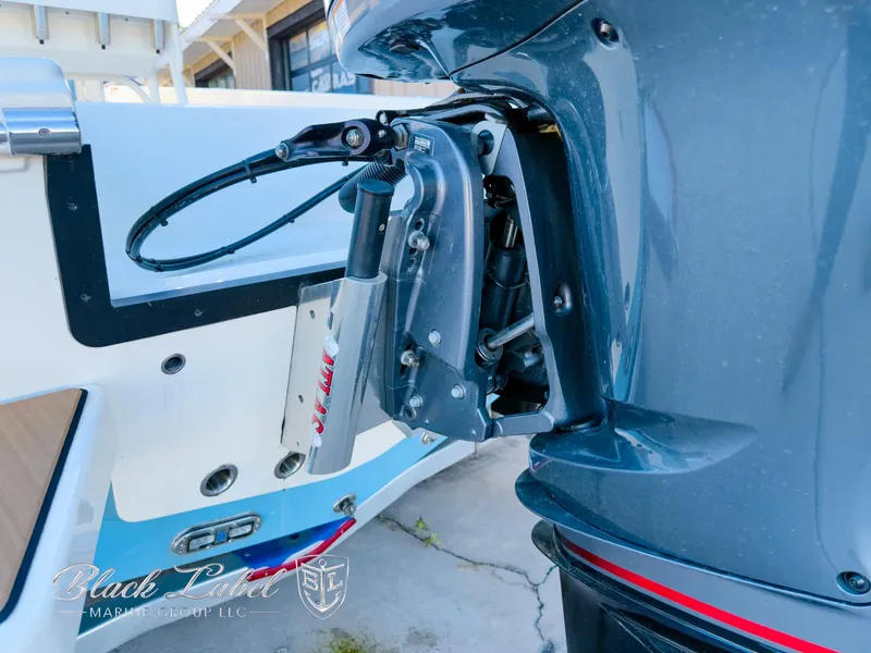 Slide: The Image of 2024 Pathfinder TRS 2200 boat engine mount detail with hydraulic components. - 32