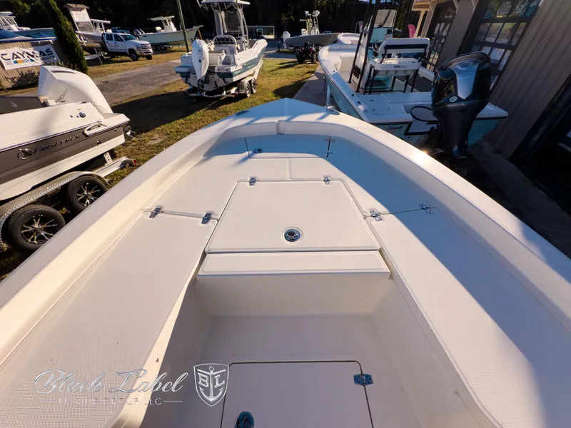Slide: The Image of 2024 Pathfinder TRS 2200 boat interior, showcasing spacious deck and storage compartments. - 9