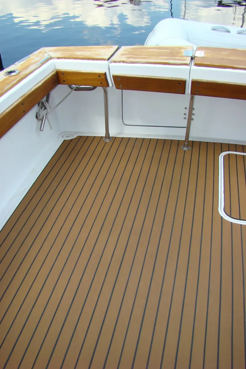 Slide: The Image of 1985 Jersey Dawn 40 boat deck with wood trim and clean finish. - 16