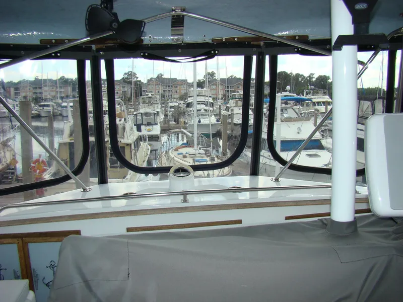 Slide: The Image of View from the cockpit of a 1985 Jersey Dawn 40 yacht at a marina. - 22