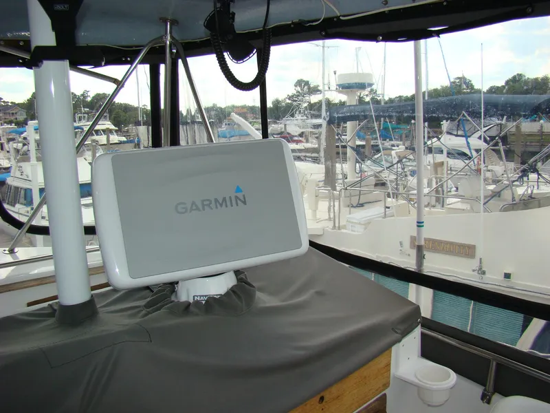Slide: The Image of 1985 Jersey Dawn 40 boat with Garmin navigation system at marina. - 23