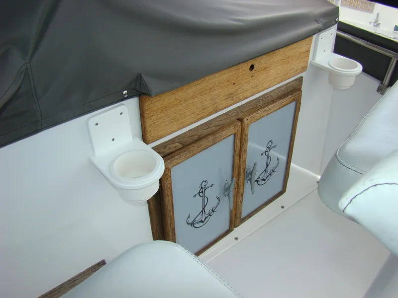 Slide: The Image of Interior of 1985 Jersey Dawn 40 boat with anchor-themed cabinet doors. - 24