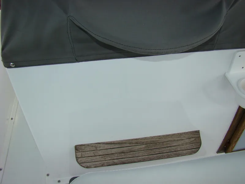 Slide: The Image of 1985 Jersey Dawn 40 boat interior with wooden step and white panel. - 25