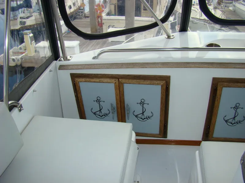 Slide: The Image of 1985 Jersey Dawn 40 boat interior with anchor-themed cabinet doors. - 26