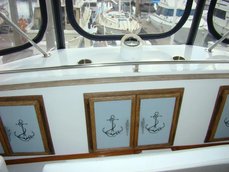 Slide: The Image of Interior of 1985 Jersey Dawn 40 boat with anchor-themed cabinet doors. - 27