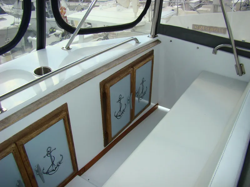 Slide: The Image of Interior of 1985 Jersey Dawn 40 boat with anchor-themed cabinet doors. - 28