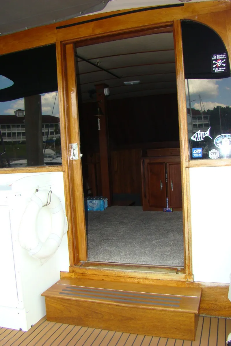 Slide: The Image of 1985 Jersey Dawn 40 boat interior entrance with wooden door and step. - 39